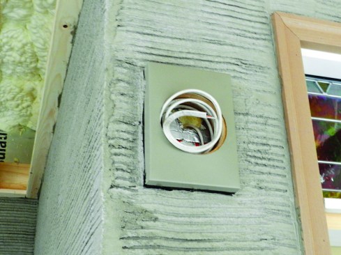 The mason applied a very heavy scratch coat to provide a secure bond for the stone veneer. For the mortar, he used Spec Mix Stone Veneer Mortar VM-01