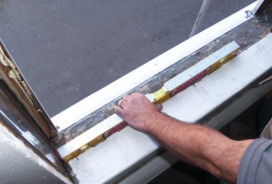 For a typical unit, I’ll use three screws, one in the middle and one about an inch from each end.