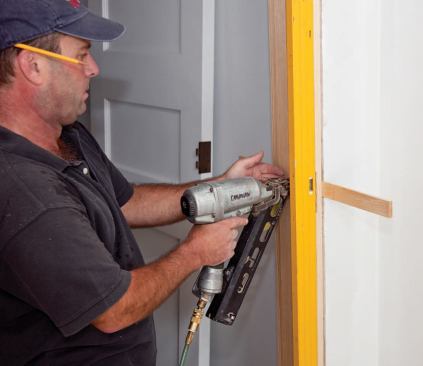 A finish nail through the jamb prevents the shims from loosening. They'll split readily around the nail if further adjustment is needed.