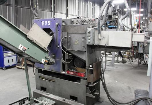 This is one of many nail making machines in the plant. Wire enters from the right and exits to the left as partially finished nails—cut to length, pointed, and headed. 
Click here for video.
