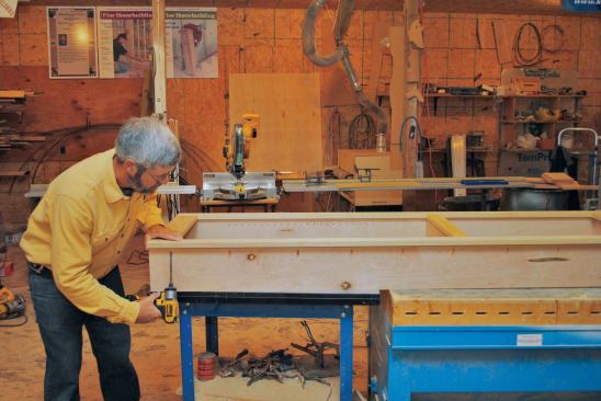 A simple stile-and-rail face frame is fastened to the case with glue and pocket screws. A strong connection here is imperative because the face frame has to double as a door handle. 