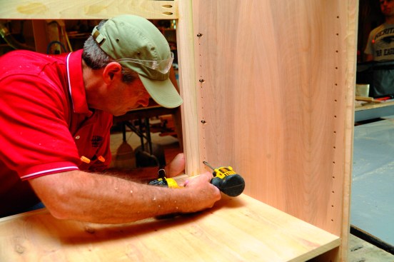 Pocket screws driven from the inside attach the cabinet carcass to the face frame.