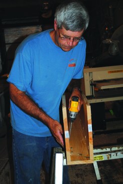 The author pocket screws 1x12 sides to a bottom to create a deep box beam with hidden fasteners. The beam can be attached to blocks on the ceiling.