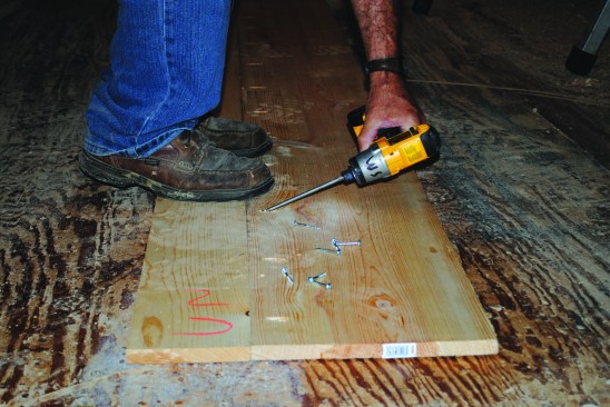 If wider boards are needed for bigger box beams, two boards can be edge-glued and pocket screwed together. Standing on the boards aligns the edges where clamps can't reach.