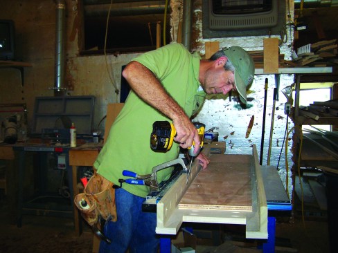 Pocket screwing sides to a face frame turn it into a thicker component for pilasters on a fireplace surround. Note that the face frame is slightly proud of the sides. The excess will be routed off later.