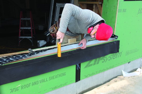 A 10-inch-wide strip of felt paper was stapled below the opening to help shed moisture.