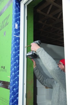 The free side of the opening for the operable portion of the window was attached with screws driven through the frame.