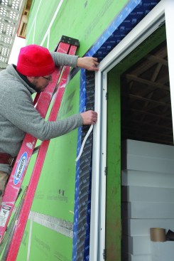 The jamb flashing was first adhered to the window frame and then extended over to the rough-opening flashing.