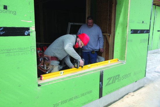 A 5/4-by-6-inch dam was installed across the length of the sill to support the window.