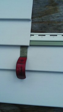 The unlocking tool hooks the top panel to engage it with the newly-added strips.