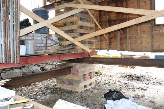 Cribbing supports a main beam (running right to left), which supports the needle beams (red). Running parallel to the needle beams was the I-beam track.