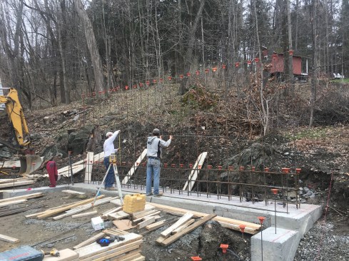 A freestanding retaining wall was part of the foundation design.