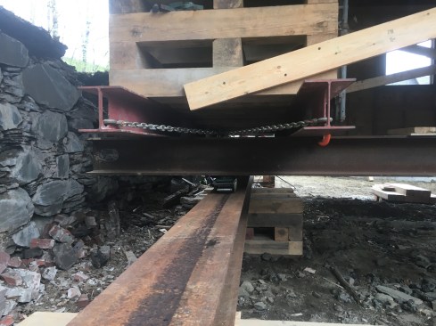 Four 10-ton-rated Hilman rollers, two per track, were used to roll the building in place.