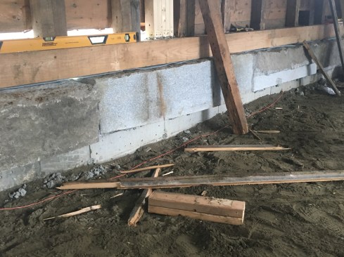 The building was lowered onto new 6x7 sills set on the granite.