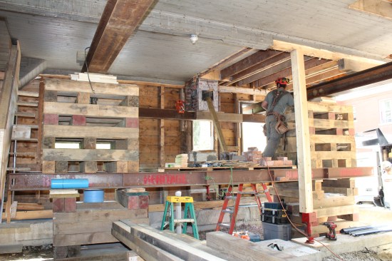 The cribbing towers were lowered one tier at time, the steel rolled out with beam rollers.