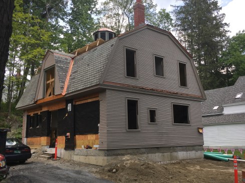 Here, the carriage house is in position, ready for complete restoration.