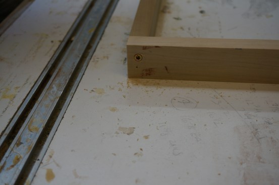 After gluing and tacking the joint together, drive a screw to secure the joint permanently.