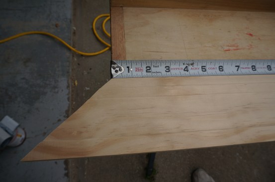 To measure from the short point of a miter, line it up with the edge of the work table and pull the measurement from there..
