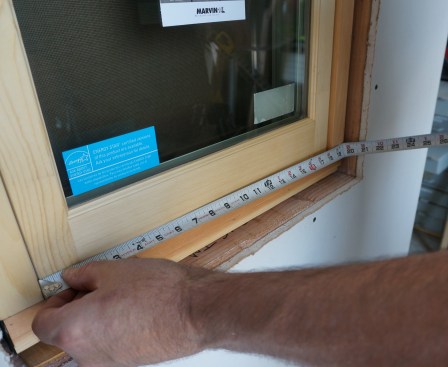 Next, measure the inside dimensions of the window frame both vertically and horizontally. Record these measurements.