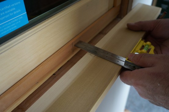 Measure and mark the centerline on the window frame as well as on stool stock. Hold the stock in place and align the centerline marks.