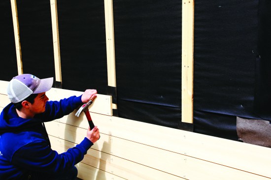 Tabs of building paper can be inserted as the siding goes on.
