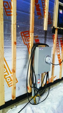 Services such as this electrical meter are furred off the wall as part of the siding.