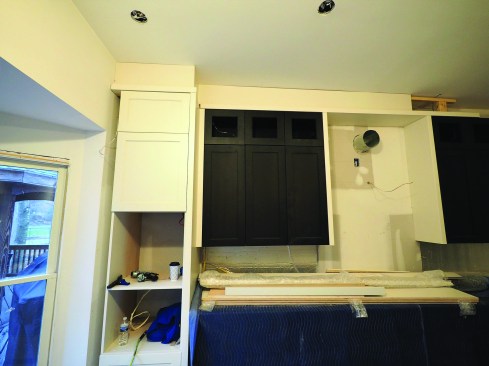 Sometimes, trim above a cabinet can accentuate an out-of-level ceiling, as with the ceiling in this kitchen. The solution was removing the trim and leaving open space between the top of the cabinets and the ceiling.