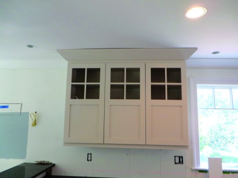 Slight variations in the ceiling can often be remedied by floating drywall compound down to the level of the crown molding.