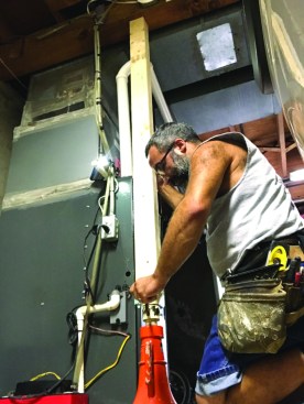 A house jack temporarily lifted and supported the girder for the repair.