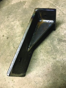 An engineer recommended supporting the girder with a steel bracket, which the author had fabricated locally.