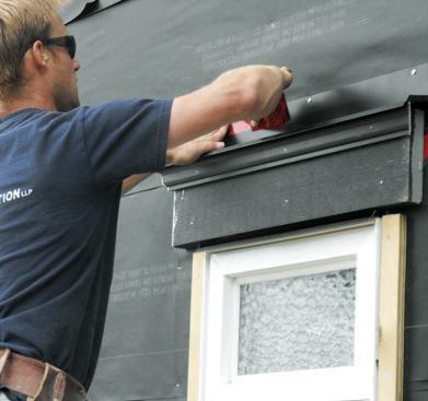 The secondary flashing is sealed to the building paper with flashing tape.