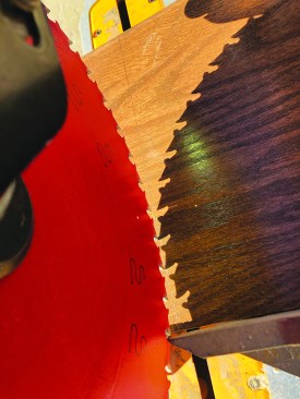 Then he carefully sets the angle of the saw blade before cutting the stock to the layout lines.