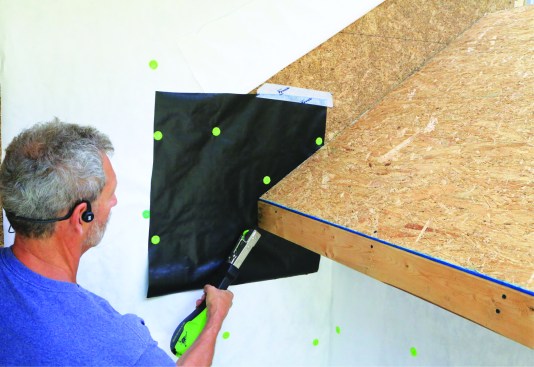 The WRB is stapled into place.