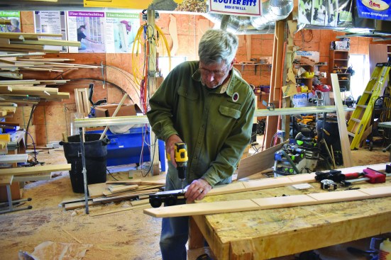 The author drills holes for the rollers ...