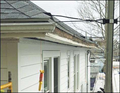 Figure 1. Roller coaster eaves. This house got an entirely new facelift, which included a tear-off and replacement of all the old siding and trim. But rather than demolish the eaves and rebuild them, the author chose to lay over the old eaves with a new assembly.