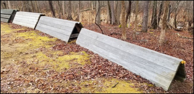 Trapezoidal-shaped “coop” jumps are commonly used in eventing. Jumps are often stored outside, so they have to be built out of durable materials.