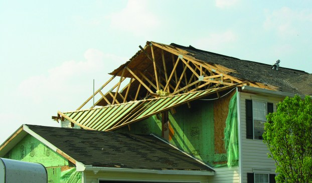 Negative wind pressure from Hurricane Wilma in 2005 pulled the top of the gable end outward after it ripped off the sheathing at the edge of the roof. Bracing tied back to the other trusses may have prevented this.