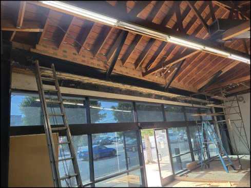Roof connections. Completed structural work at the angled, wall-to-wall storefront opening includes the steel angle lintel, steel angle …