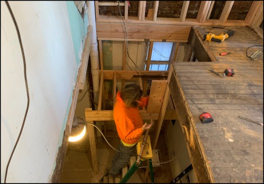 One of the code challenges with the stair was to create a continuous handrail on the right-hand side of the stairway as you walk up. JP, a carpenter with Passaic Stairs, worked out the distance the lower run of stairs needed to be offset to accommodate the handrail, which needed room to gooseneck up to a let-in newel at the stairwell’s corner and connect at this newel to the short rail for the top three steps; that rail then tied into the top newel post on the second-floor guard (see finish photos below).