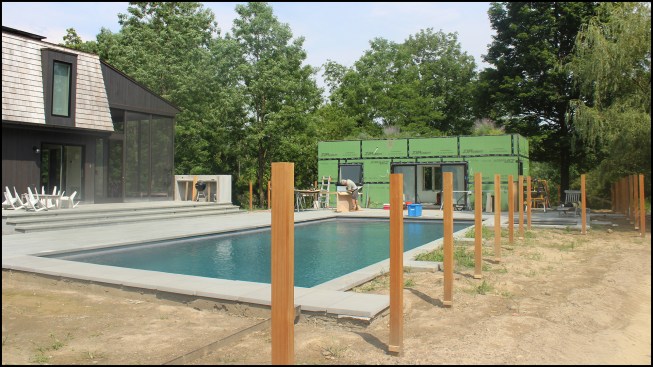 After installation, the posts were trimmed level with a portable 6-inch battery-powered band saw.