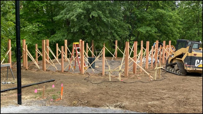 Alternating 6x6 and 4x4 cedar posts were installed in the garden area; here, they have been aligned, plumbed, and braced, and are ready for concrete.