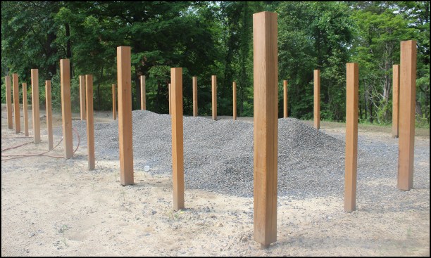 In this area, the fence design required taller, 6x6 cedar posts with three stainless steel cables run between them at the top to prevent deer from bounding into the garden.