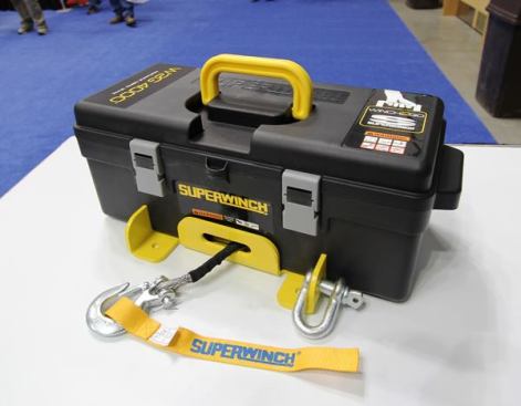 Superwinch’s Winch2go is a portable winch that can be powered by a 12-volt battery or battery pack. Able to pull up to 4,000 pounds, it’s designed for use in confined or hard-to-reach places. The motor is attached to a 1/4-inch steel base plate and housed within a plastic toolbox that contains everything needed for use with the winch: d-rings, a shackle, fabric straps, a remote control, and battery cables. Winch2go includes 50’ of wire cable or synthetic rope and sells for about $280. 
Click here for video.