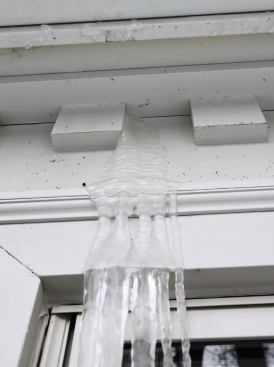 Not-so-subtle evidence: icicles growing out of a soffit.