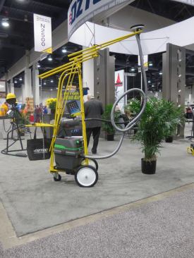 This odd looking contraption is an
Oztec Concrete Ceiling Grinder. I talked to a guy at the booth and he said it is used to remove the ridge that is left at the joint between forms. This thing is basically a grinder head connected to a big motor by a monstrous flexible shaft. The head is attached to a spring-loaded arm that holds it against the ceiling. This particular setup costs something like $3,800.