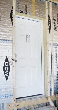 To provide an unobstructed swing, exterior doors were installed as if in a conventional 2x6 wall.