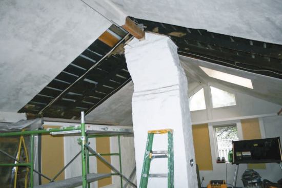 The ends of ridge beams were actually supported by the abandoned chimney.