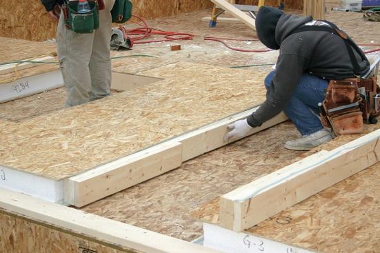 Where a beam end meets the wall above a window, foam is routed out of the panel at the opening edge of the window, allowing the crew to insert jack posts into the recess.