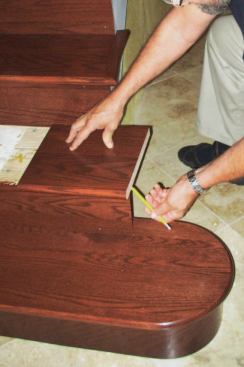 Trace the Skirt: I start by tracing the outline of the skirtboard and its intersection with the riser on a piece of scrap tread stock (B).
