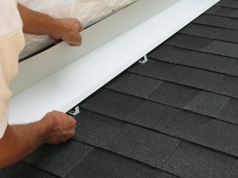 Next Mike sets the continuous flashing in place over the clips.